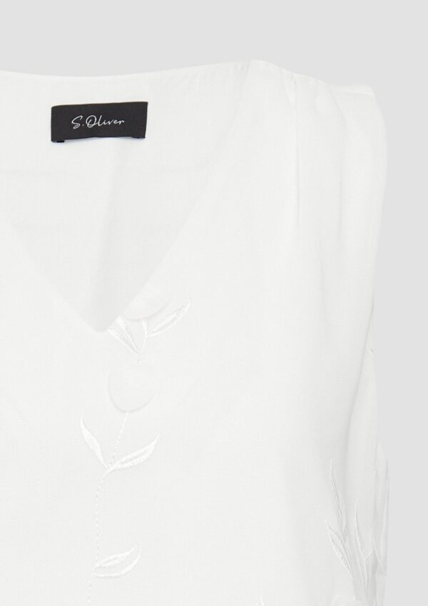 Ärmellose Bluse mit V-Ausschnitt und floralen Applikationen