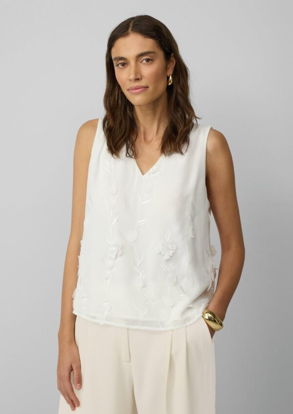 Ärmellose Bluse mit V-Ausschnitt und floralen Applikationen