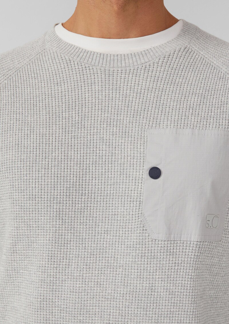 Strickpullover mit Brusttasche und Druckknopf